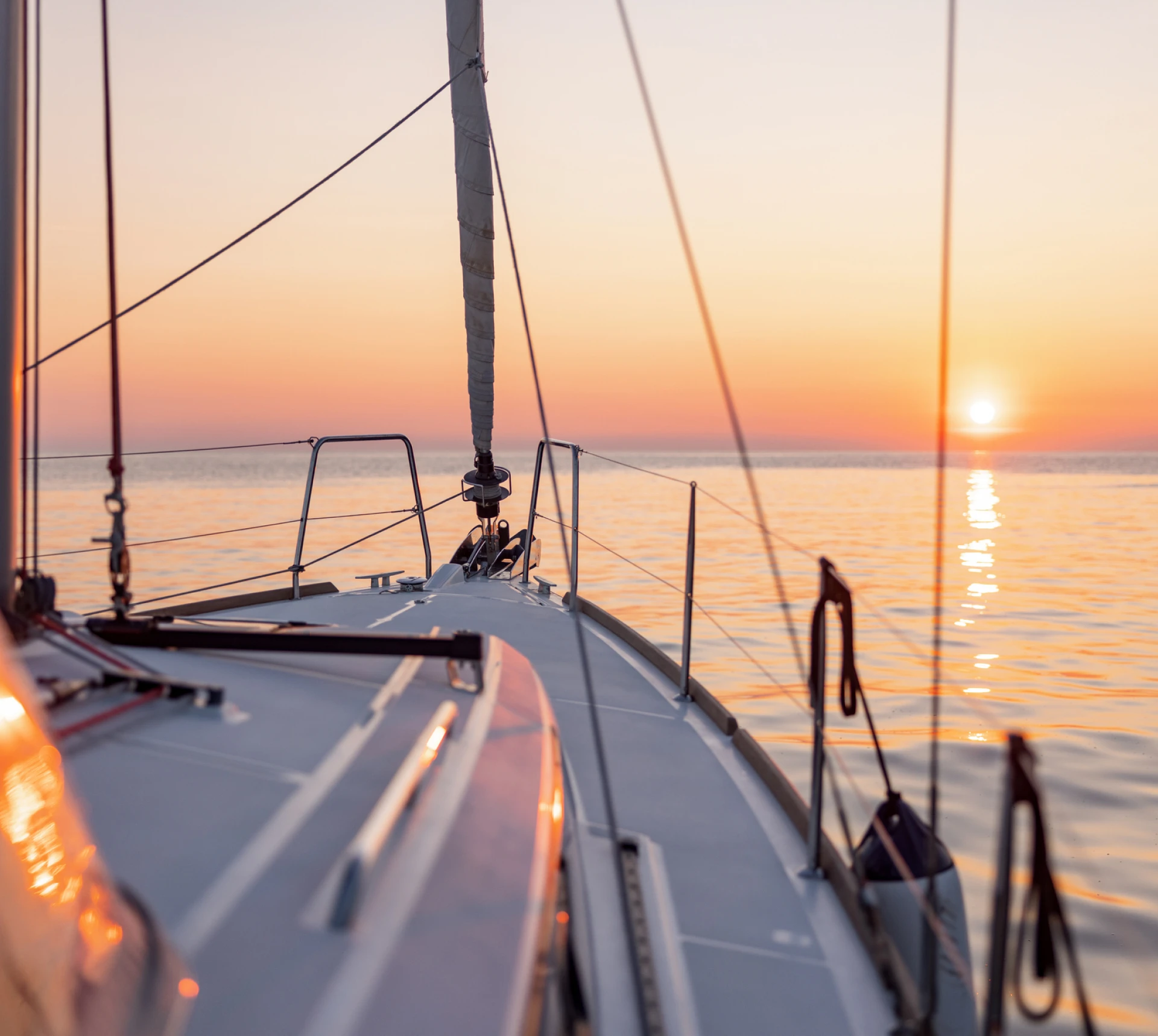 Peaceful evening sailboat journey at sunset