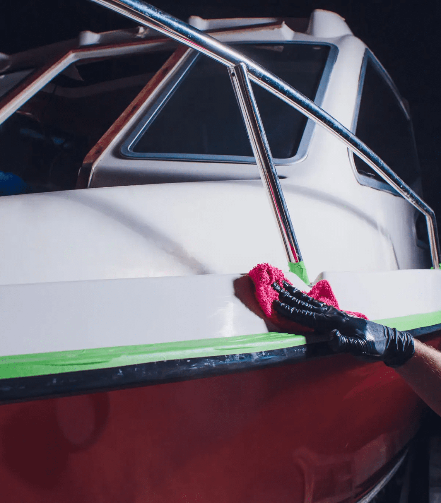 Polishing a boat with red cloth