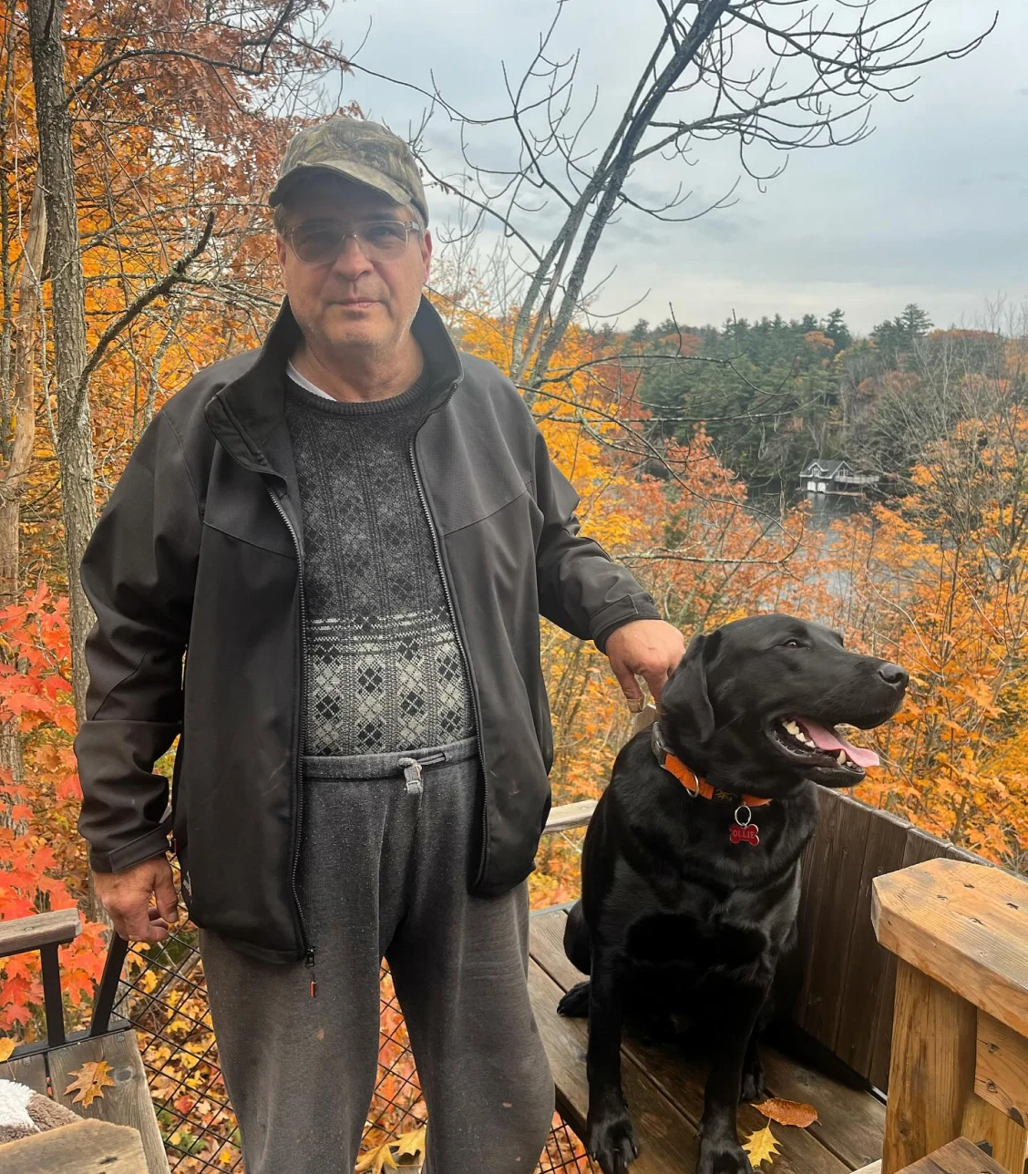 Man and dog enjoying fall scenery